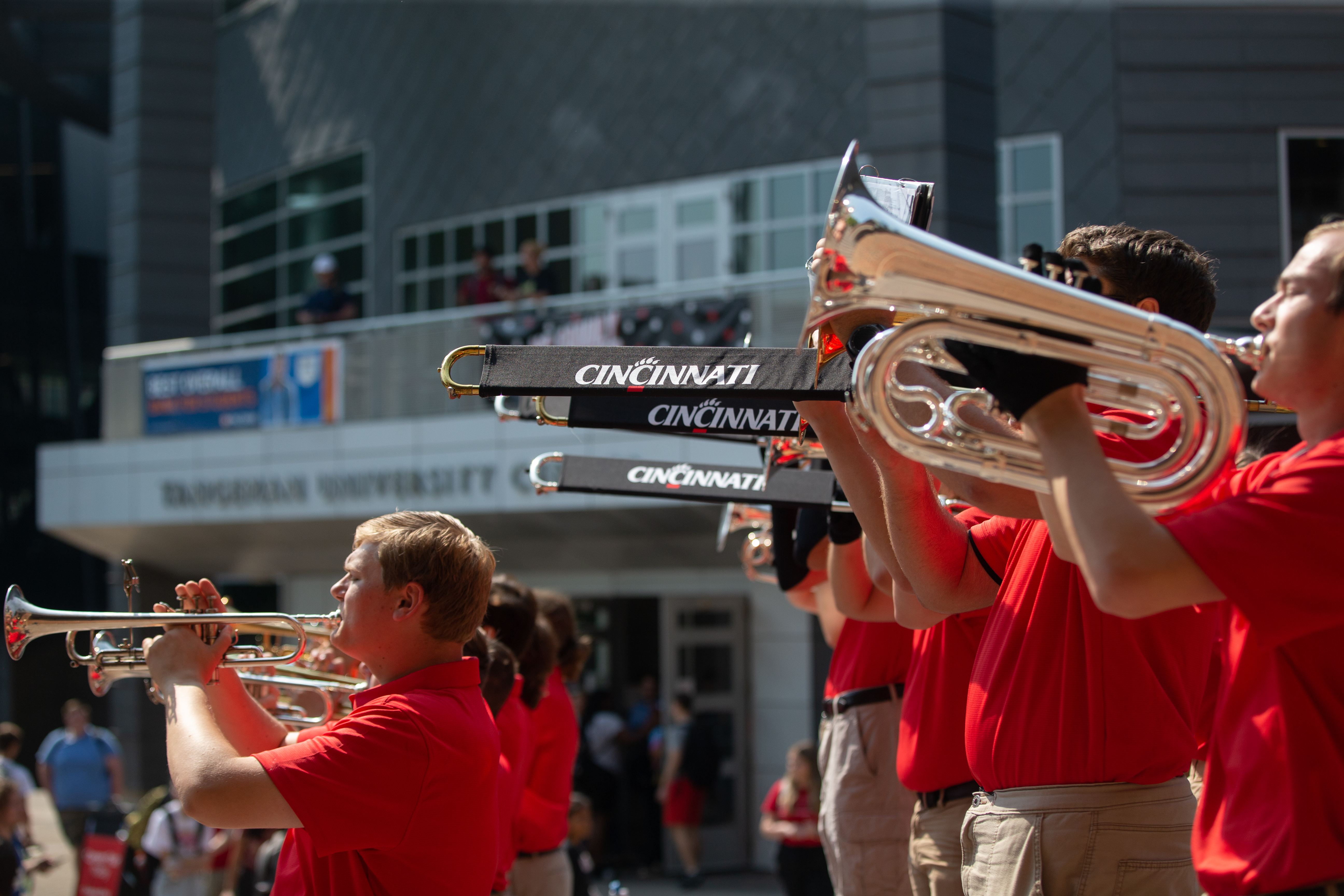 Family Weekend events around campus. The marching band performs at a pep rally on Main Street.